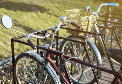 Close-up of bicycle parked on field