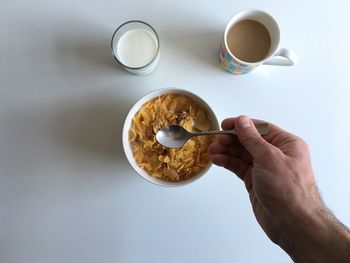 Cropped image of person having breakfast