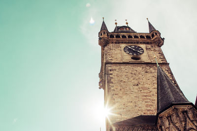 Low angle view of clock tower against sky