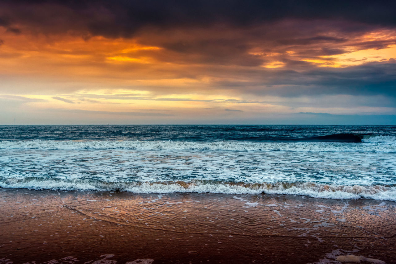 sea, water, sky, land, beach, sunset, cloud, beauty in nature, ocean, horizon, scenics - nature, wave, wind wave, nature, shore, horizon over water, motion, dawn, body of water, sunlight, environment, coast, dramatic sky, evening, tranquility, seascape, surfing, water sports, travel destinations, sand, tranquil scene, sports, travel, outdoors, idyllic, landscape, coastline, sun, trip, holiday, vacation, reflection, tourism, water's edge, cloudscape, orange color