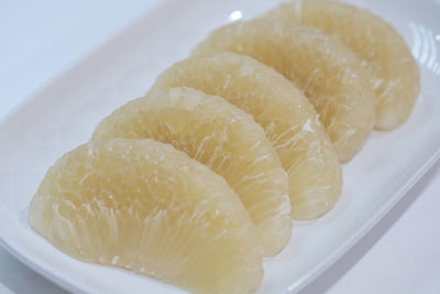 Close-up of lemon slice in plate