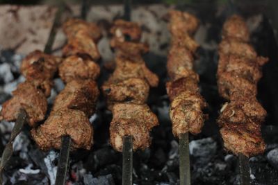 Close-up of meat on barbecue grill