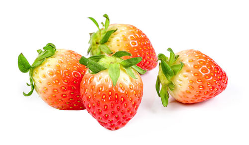 Close-up of strawberries against white background