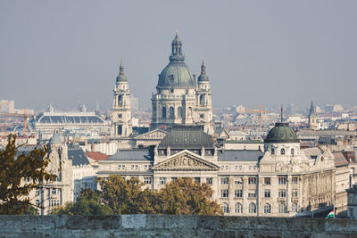 Buildings in city against sky