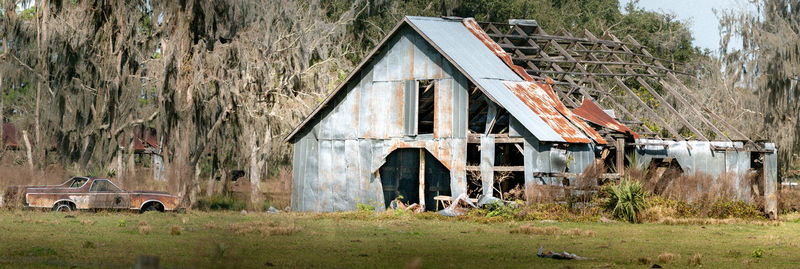 Abandoned building on field