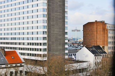 Buildings in city against sky