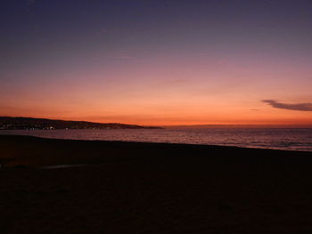 View of beach at sunset