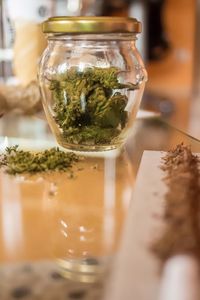 Close-up of glass jar on table