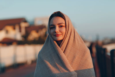 Portrait of smiling woman standing outdoors