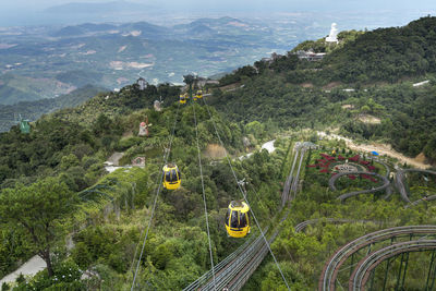 High angle view of railroad tracks amidst plants and trees