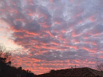 Low angle view of dramatic sky during sunset