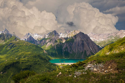 Fantastic cumulonimbus clouds over the lake morasco in the italian alps