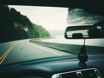 Road seen through car windshield