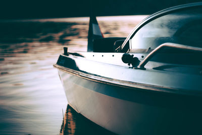 Close-up of boat moored at pier