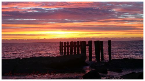 Scenic view of sea against dramatic sky