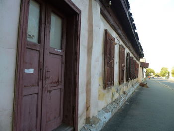 Empty alley amidst buildings in city