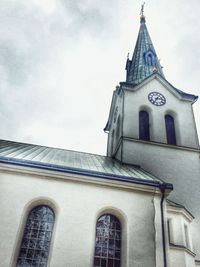 Exterior of historic church against sky