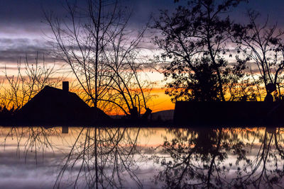 Scenic view of lake at sunset