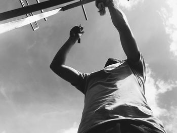 Low angle view of man against sky