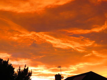 Low angle view of cloudy sky at sunset