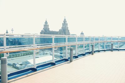 Bridge over building against clear sky