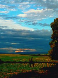 Scenic view of landscape against cloudy sky