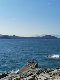 Scenic view of sea against blue sky