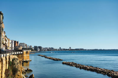 Scenic view of sea against clear blue sky