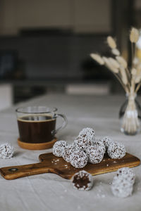 Coffee and balls covered with coconut