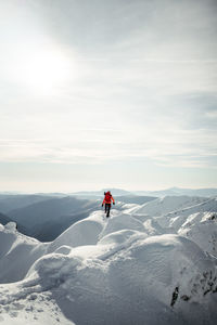 People skiing on snow covered mountain