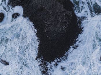 High angle view of water splashing in sea