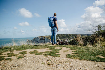 Full length of man standing on land against sky