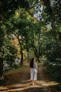 Woman standing in forest