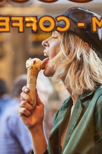 Midsection of woman holding ice cream