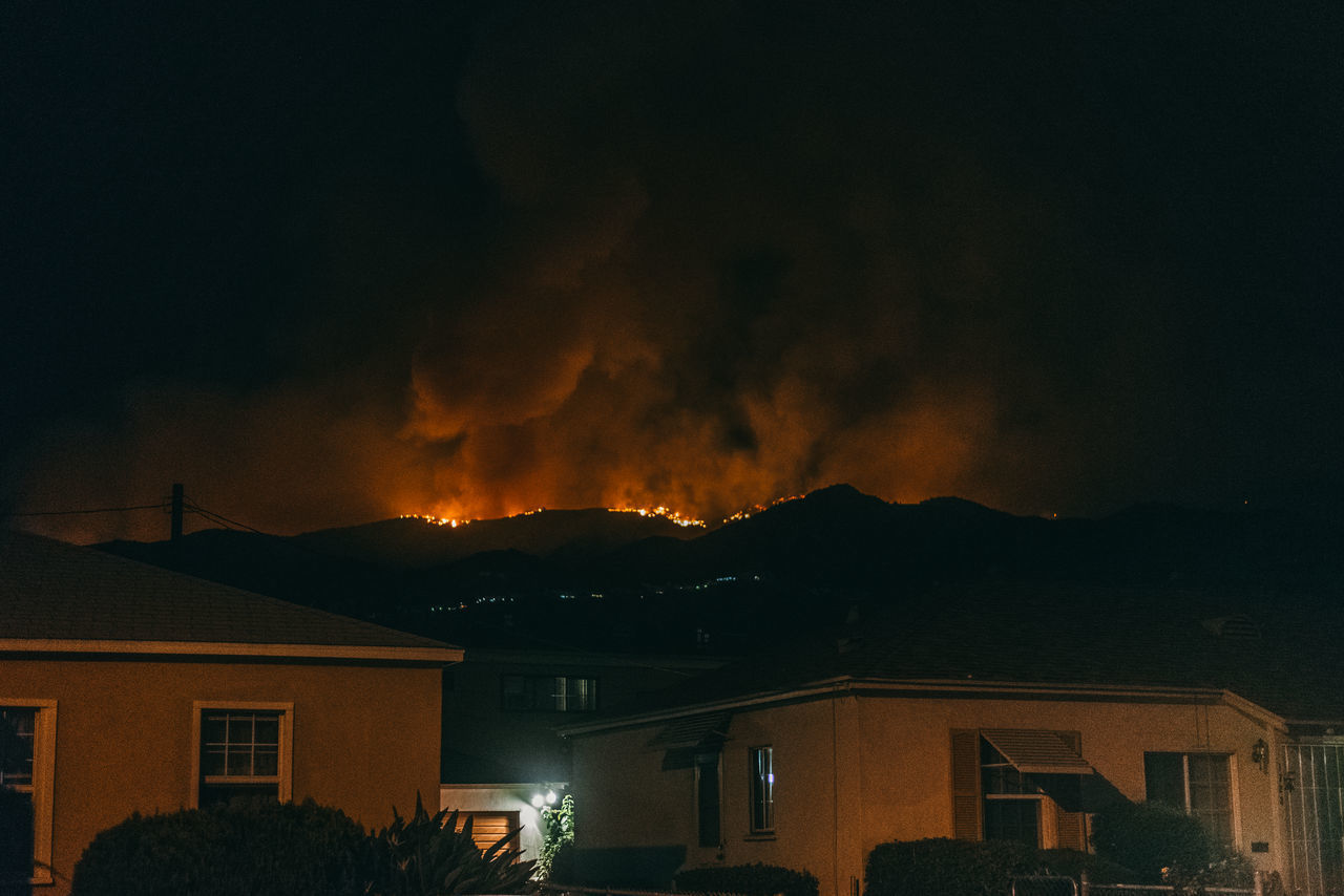 PANORAMIC VIEW OF HOUSE AGAINST SKY AT NIGHT