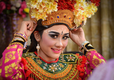 Portrait of a smiling young woman wearing mask