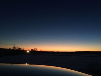 Scenic view of silhouette landscape against clear sky at sunset