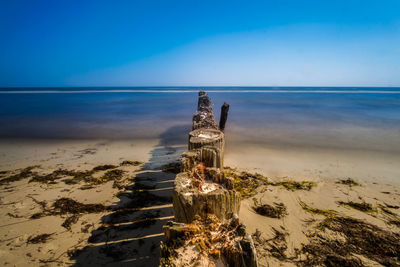 Scenic view of sea against clear blue sky