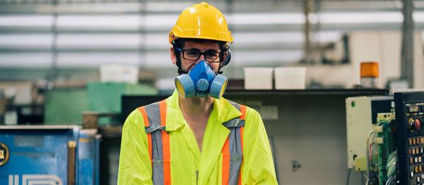 Portrait of man working with umbrella