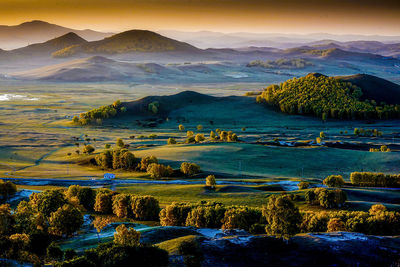 Scenic view of landscape against sky during sunset