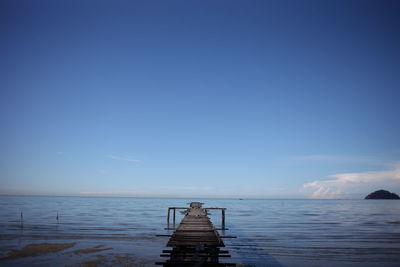 Pier on sea against sky