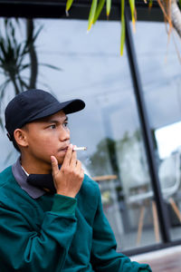 Portrait of young man looking away