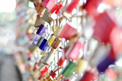 Close-up of padlocks hanging on metal