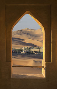 View of arch window against sky