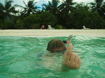 Boy swimming in pool