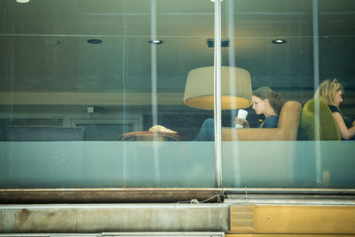 People looking through train window