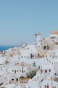 Panoramic view of buildings and sea against clear sky