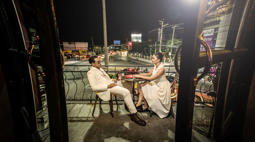 People sitting in restaurant at night