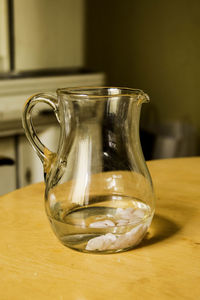 Close-up of jug on wooden table