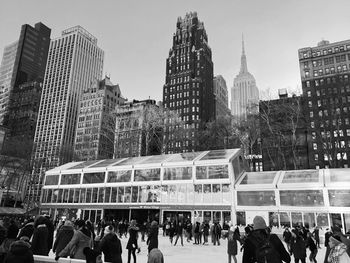 Group of people on modern buildings in city